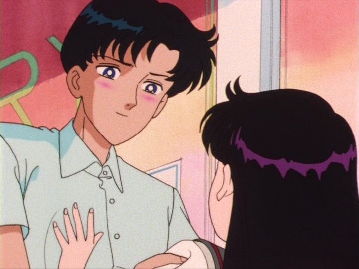 Mamoru blushes while looking at Rei