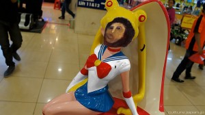 Creepy topless Sailor Moon statue with a white top and a Jesus face