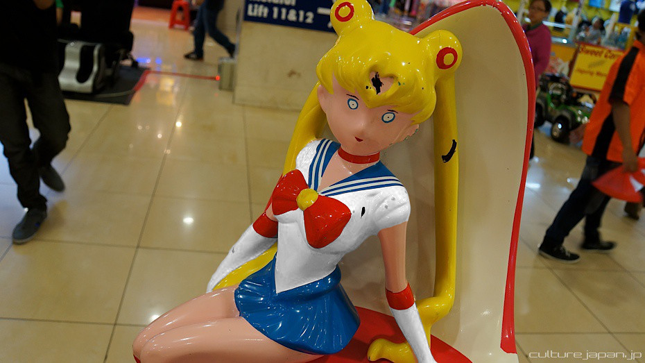 Creepy topless Sailor Moon statue with a white top