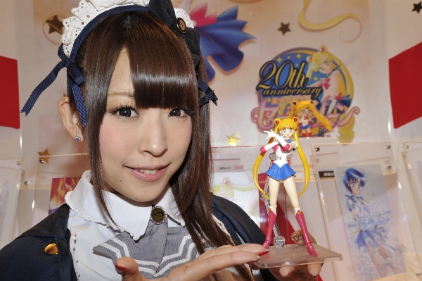 A japanese girl with a Bandai Figuarts Sailor Moon figure