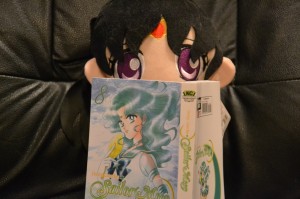 Sailor Mars reading Sailor Moon manga vol. 8 - Sailor Neptune cover
