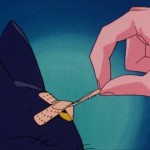 Sailor Moon episode 1 - Usagi removing a bandage from Luna's head