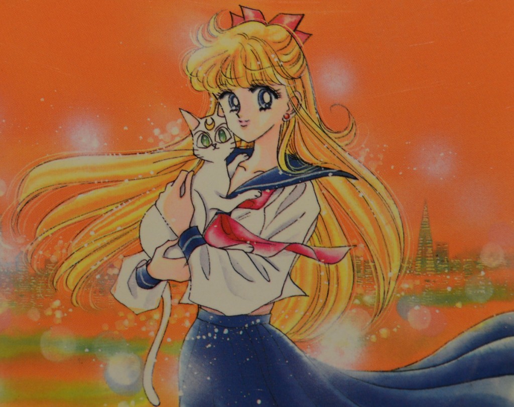Minako Aino's sleeves are too long in this picture with Artemis in the Sailor V Manga