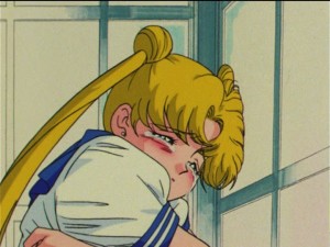 Usagi crying in a phone booth