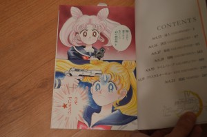 Chibiusa aiming a gun at Usagi's head - Volume 3 of the Complete Edition of the Sailor Moon Manga