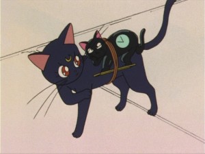 Sailor Moon episode 9 - How did Luna tie this clock to herself?