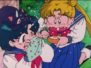 Sailor Moon R episode 55 - Ami and Luna shield themselves as Usagi eats