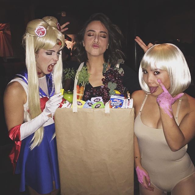 Emily Bett Rickards dressed as Sailor Moon, Chloe Bennet dressed as grocery bag