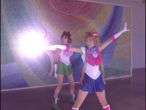 Live Action Pretty Guardian Sailor Moon Act 7 - Sailor Jupiter and Sailor Moon in front of a mural