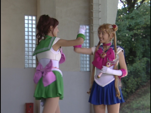 Live Action Pretty Guardian Sailor Moon Act 7 - Sailor Jupiter and Sailor Moon in front of windows