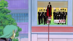Sailor Moon R The Movie - Tuxedo Mask in front of a billboard