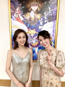 Keiko Kitagawa and Kotono Mitsuishi with a Sailor Moon Cosmos Poster